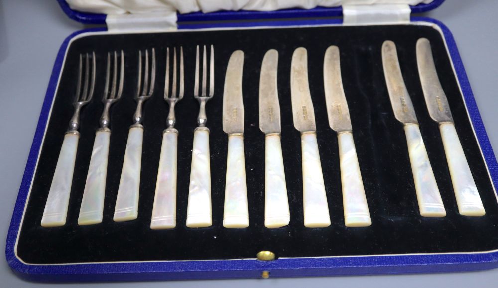 A pair of Continental silver grape scissors, a cased set of six silver cake forks and sundry items